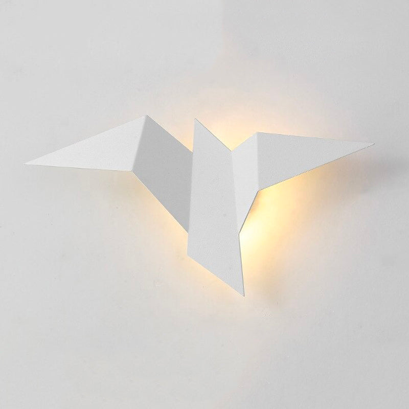 This origami-inspired LED wall light emits a warm, gentle yellow glow for ambiance.