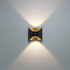 Soft, warm LED light glows both upward and downward in a geometric hourglass pattern.