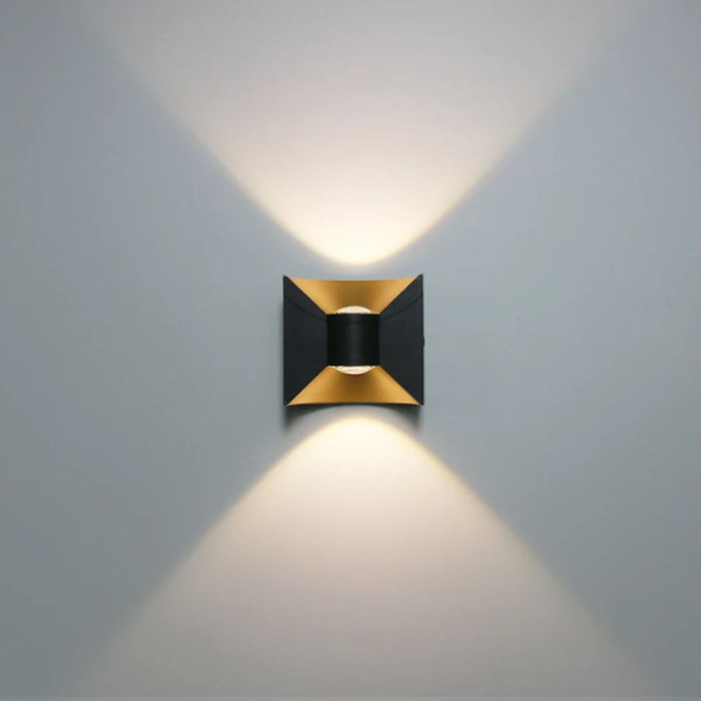 Soft, warm LED light glows both upward and downward in a geometric hourglass pattern.