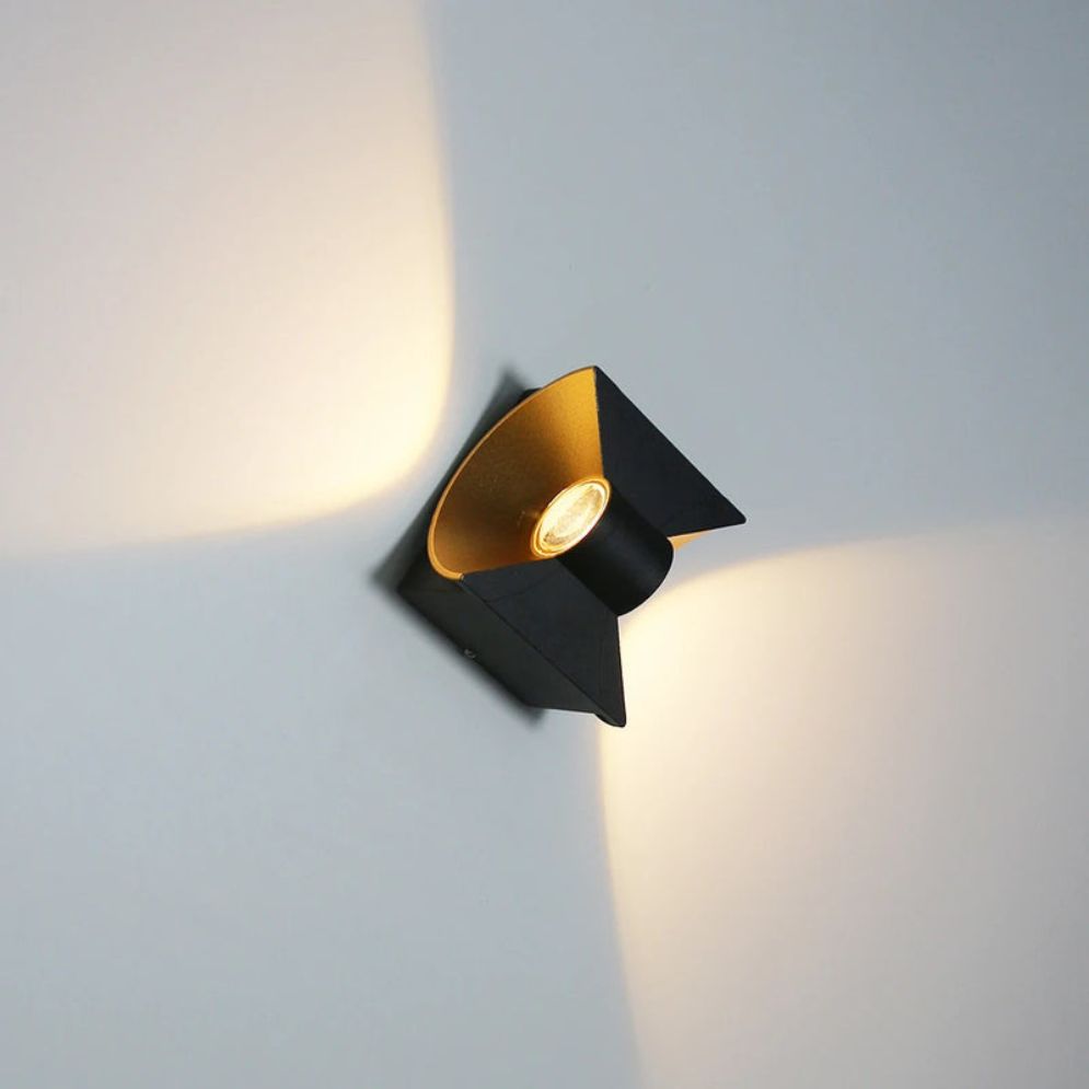 Warm X-pattern up-and-down lighting enhances exteriors with striking modern illumination.