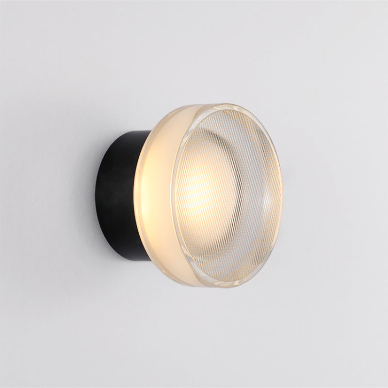 Soft, warm light shines through frosted ribbed glass, creating modern ambiance and tranquility.
