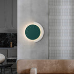 The ORLUNE HOME Circular Wall Light casts a warm, modern glow for bathroom ambiance.