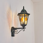 Soft light glows through stained glass panels, creating gentle patterns against the white wall.